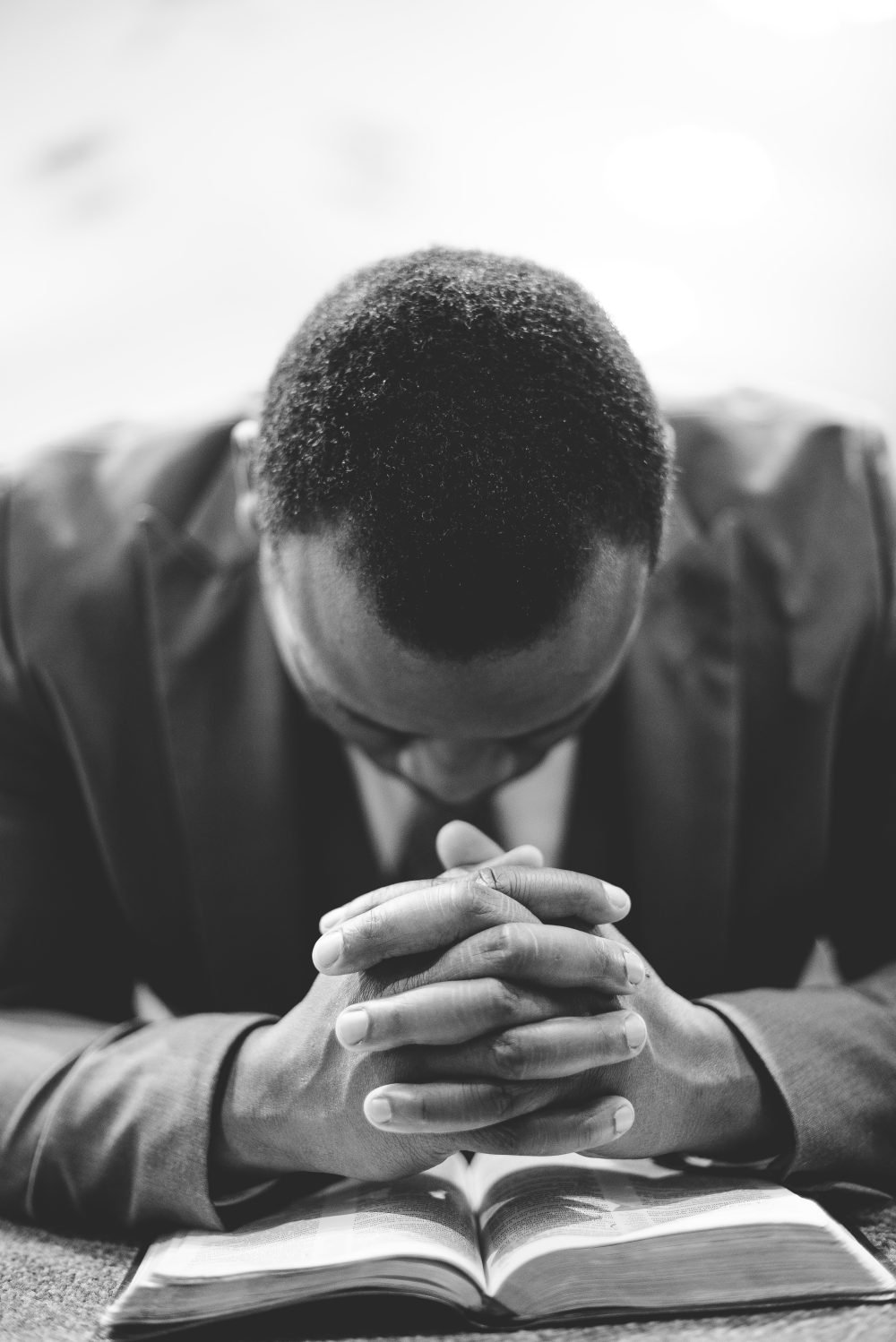 A leader in prayer over Scripture